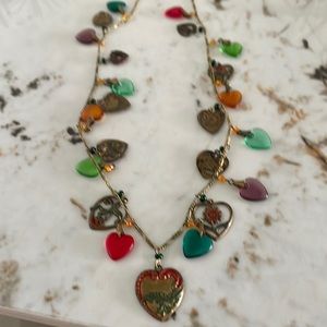 Glass works Victorian brass marked piece. Multi hanging heart necklace.